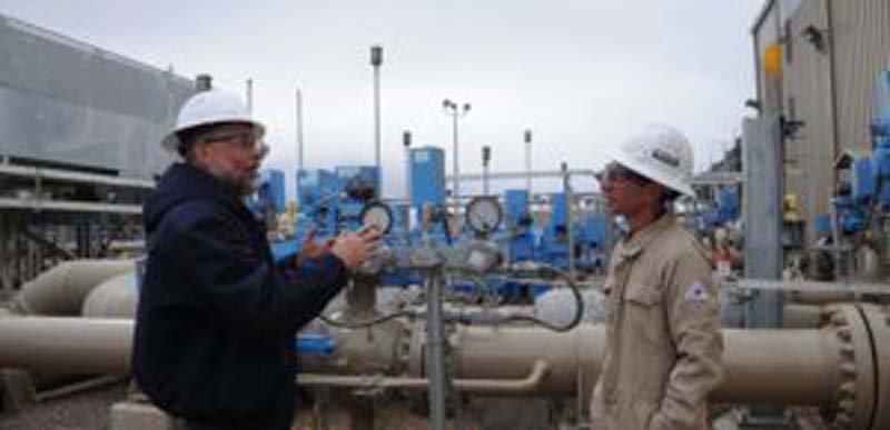 CSU Energy Institute researchers Dan Zimmerle and Anthony Marchese at a natural gas transmission station. They are starting a Department of Energy-supported field campaign to measure methane emissions from gathering compressor stations.